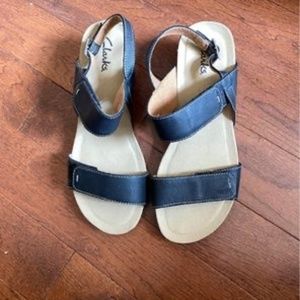 Clark’s Black Leather wedge heel sandals.